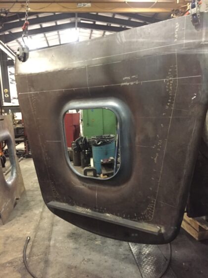 The door sheet after stamping the door hole using our 600-ton wheel press.